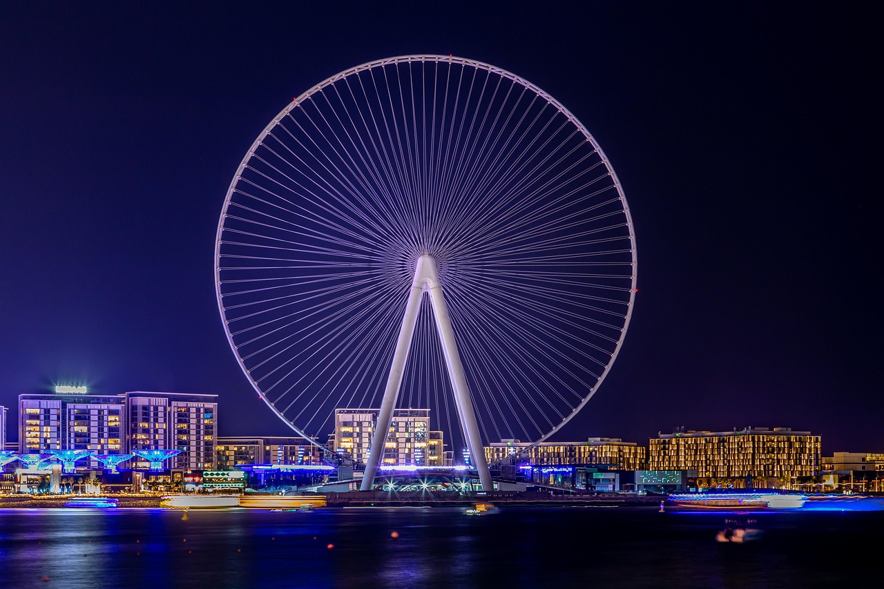 Ain Dubai observation wheel lit against the night sky